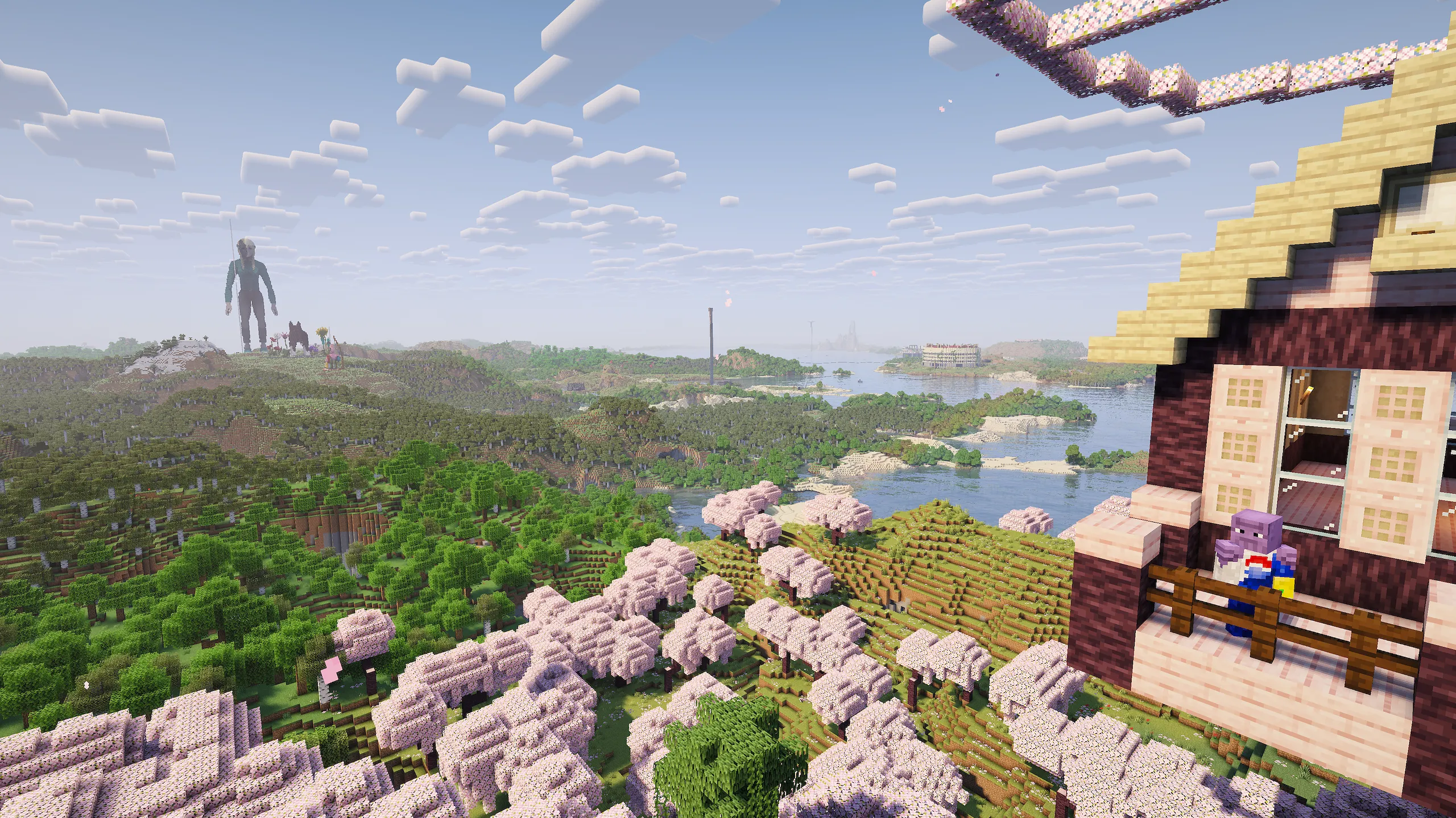 Day-time view of near undisturbed wilderness with player builds off in the distance.